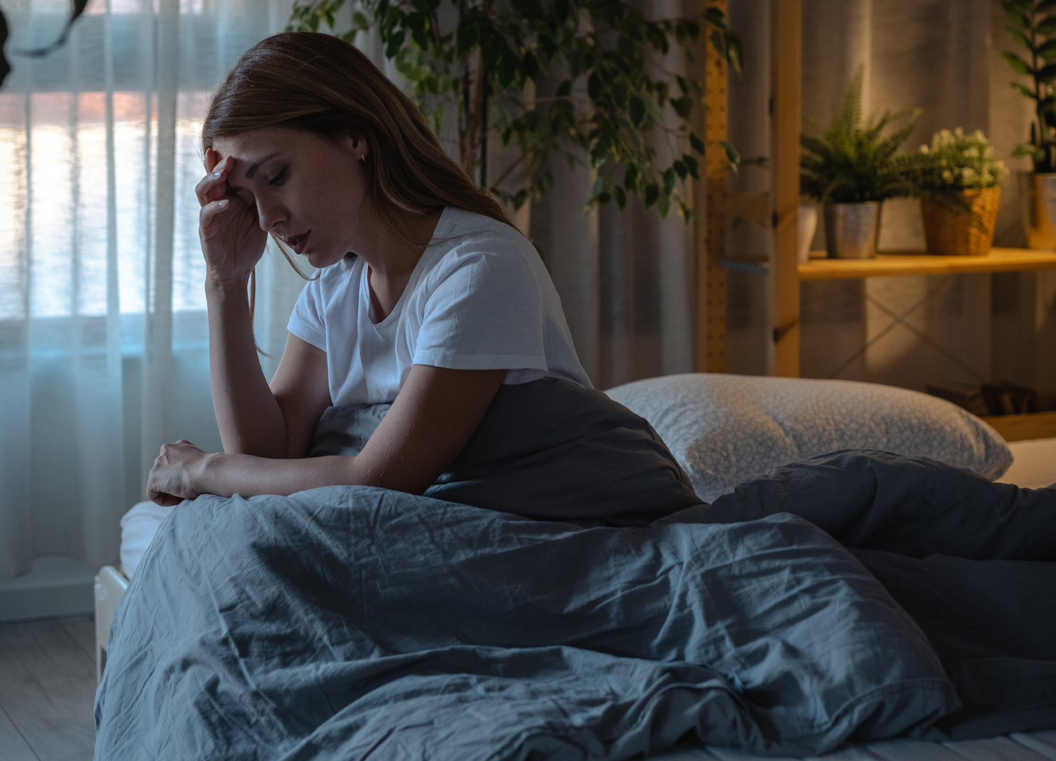 Woman in bed who is having trouble sleeping