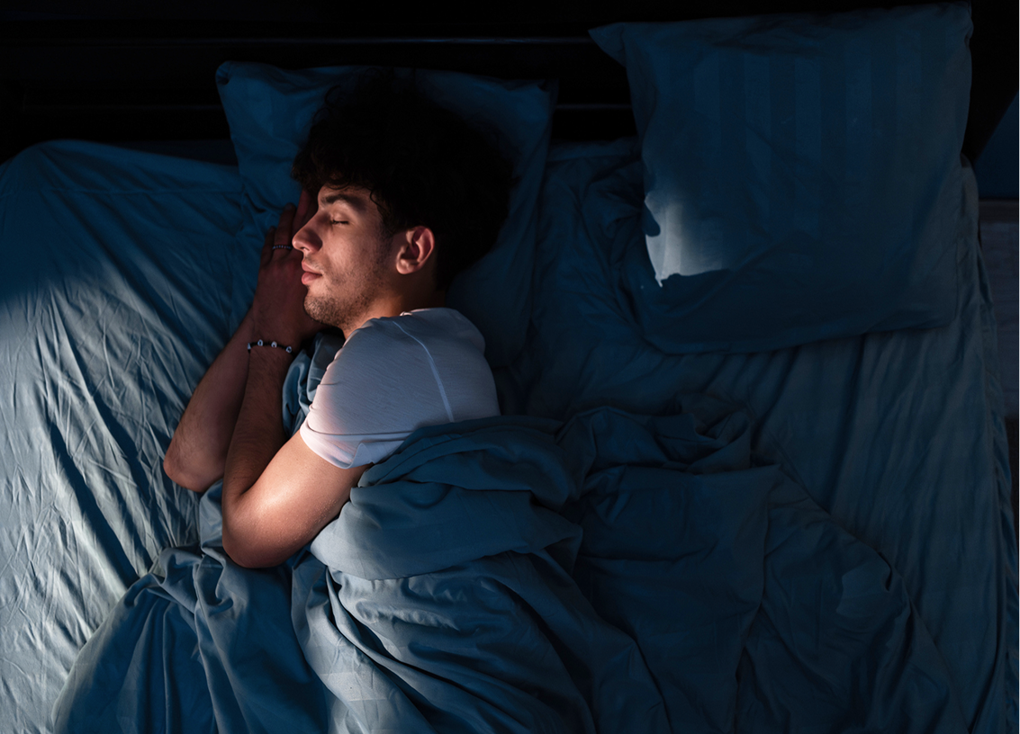 Man sleeping peacefully in bed