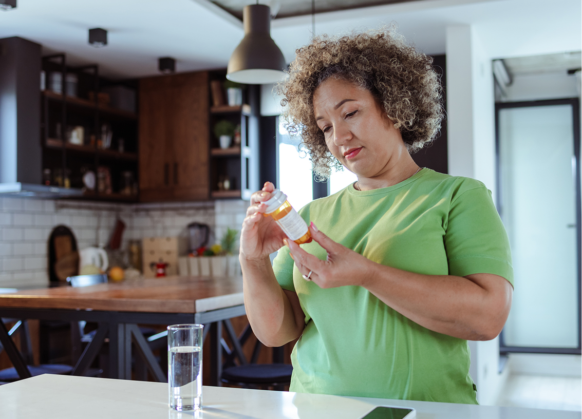 Woman checking her prescription pills